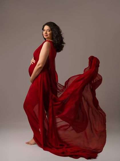 The deep red of this gown is so rich and powerful. The flowing fabric adds a beautiful sense of movement and drama.