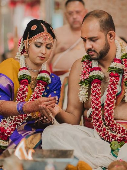 A candid moment between the couple during their South Indian wedding ceremony, a testament to their long journey to this day.