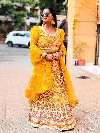This stunning yellow lehenga is designed to make you the center of attention at any Haldi ceremony. The vibrant colour and unique design are a winning combination.