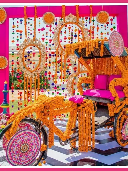 A photo-op that everyone loved. This auto-rickshaw, decorated with marigolds and traditional Rajasthani textiles, added a fun and quirky element to the wedding mela.