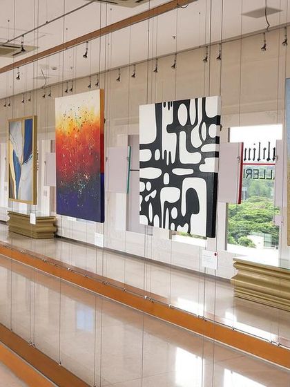 A gallery view of the 'Inner Tides' exhibition, showcasing a range of abstract, textured artworks.