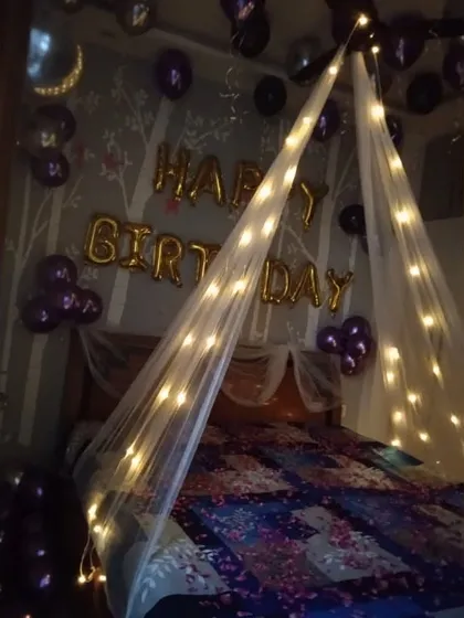 This is how I create that cozy, movie-scene vibe. A simple bed canopy is transformed with warm fairy lights, making the room feel intimate and perfect for a romantic birthday or anniversary surprise.