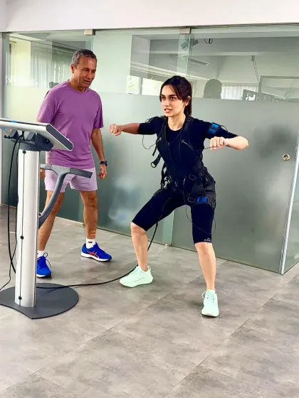 Manushi Chhillar performs a squat variation during her 20 minute EMS session. This smart workout is designed to deliver results efficiently, making it a go to for actors and professionals.