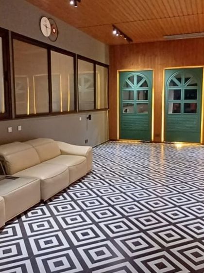 The flooring is key to defining an outdoor room. Here, we used bold black-and-white patterned tiles to create a dramatic and stylish look for this enclosed terrace lounge.