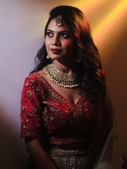 Sahana looking gorgeous for her reception. We went for a classic glamorous look with soft waves and a bold lip.