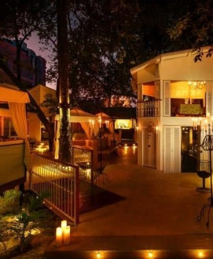Another view of the terrace at night, showing how the different levels and lighting create a sense of discovery and romance.
