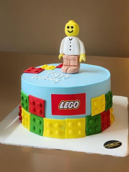 For the little builder, a Lego-themed Belgian chocolate cake. The cake is decorated with edible Lego blocks and a fondant Lego man, bringing the classic toy to the party.
