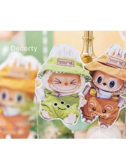 Tiny, cute Labubu character cutouts used as decorative accents.