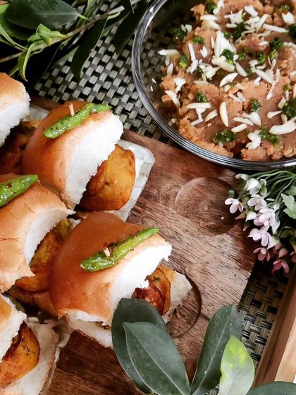 A beautifully arranged platter of our mini Vada Pavs, served alongside a sweet dish. This shows how we balance sweet and spicy flavours for a complete party menu.