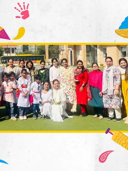 Teachers and students pose together, celebrating the spirit of Holi with warmth and camaraderie.