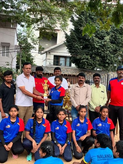 A special moment as our girls' team receives their trophy from officials at the sub-junior netball championship.