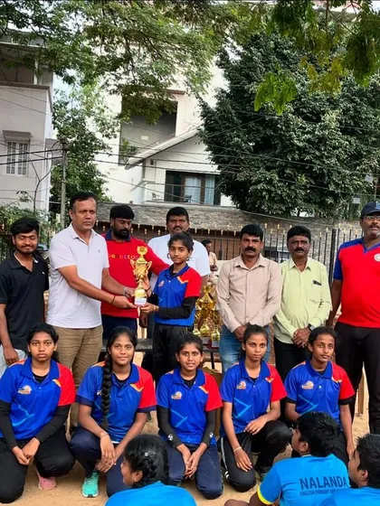A special moment as our girls' team receives their trophy from officials at the sub-junior netball championship.