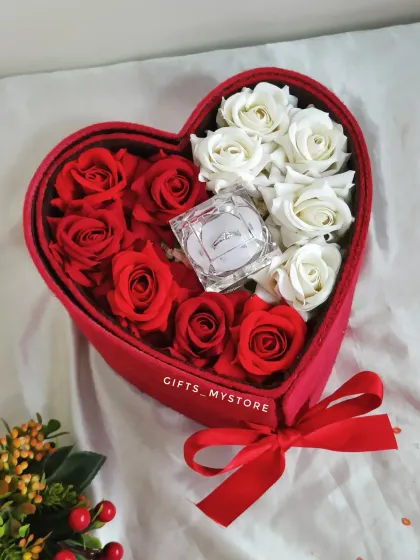 A close-up of the rose arrangement in the heart-shaped proposal box.