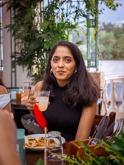 A guest enjoying a refreshing drink, taking a break to savor the moment.