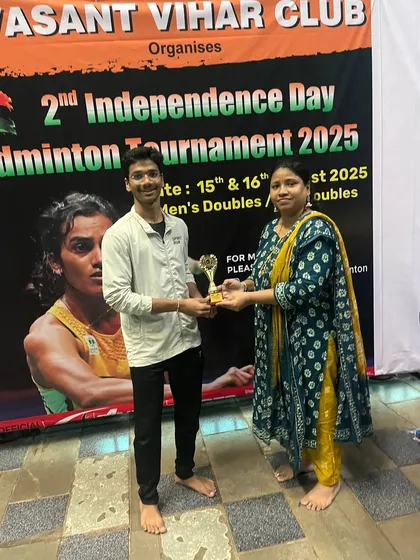 A participant receiving their trophy, a rewarding moment after days of intense competition.