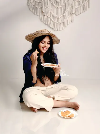 Pregnancy is also about the little joys, like satisfying those cravings. This candid, lifestyle-inspired shot brings a touch of fun and personality to your maternity gallery, capturing a real and relatable moment from your journey.