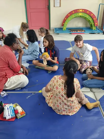 Sharing our Indian art with children from other countries is a special experience. Here I am with a group of French students during a workshop in Bangladesh.