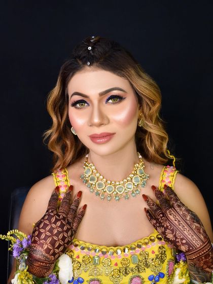 A confident and beautiful bride-to-be, ready for her Mehendi ceremony.