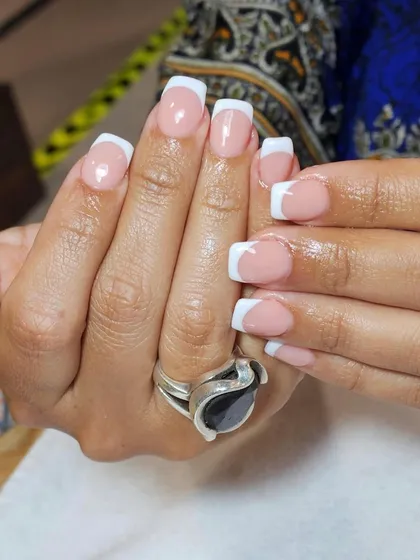 Another look at the classic French on square nails. I ensure the white tip is opaque and the line is sharp for a striking, clean finish.