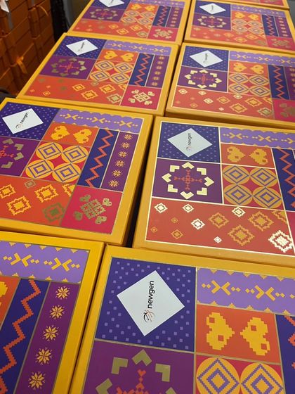 Here are some of our festive boxes ready for a corporate client, Newgen. We added their logo to our vibrant Diwali packaging, creating a co-branded gift that feels both festive and professional. It's a simple way to make a big impact.
