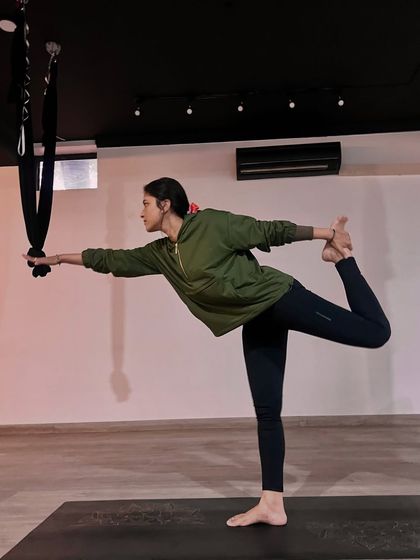 Finding balance and strength in Natarajasana, or Dancer's Pose. Even in a group setting, yoga is a personal journey of aligning the body, mind, and soul.