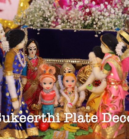 A detailed look at my thematic dolls depicting an ear piercing ceremony, with family members gathered around the child. It's these little details that make an event memorable.