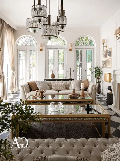 In the spirit of French elegance, this outhouse living room whispers sophistication. Arched French doors, a classic checkerboard floor, and tufted sofas create a refined yet relaxed atmosphere, perfect for an intimate retreat.