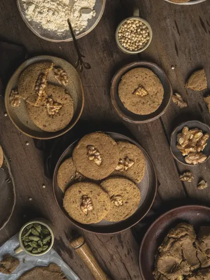 A darker, more atmospheric version of the cookie flat lay, showing how adjusting the light can change the mood from rustic to dramatic.