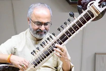 A close-up of my hands on the sitar during a concert. Each note is a prayer, a continuation of the knowledge passed down through generations.