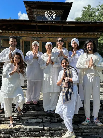 Our Sangat in white, standing together at a sacred site in Bhutan. The practice of wearing white helps to unify our energy and amplify the group aura as we move through these powerful places.
