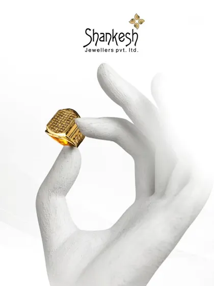 Every ring tells a story. This image of a hand holding one of our men's rings emphasizes the personal connection and style statement that our jewellery represents.
