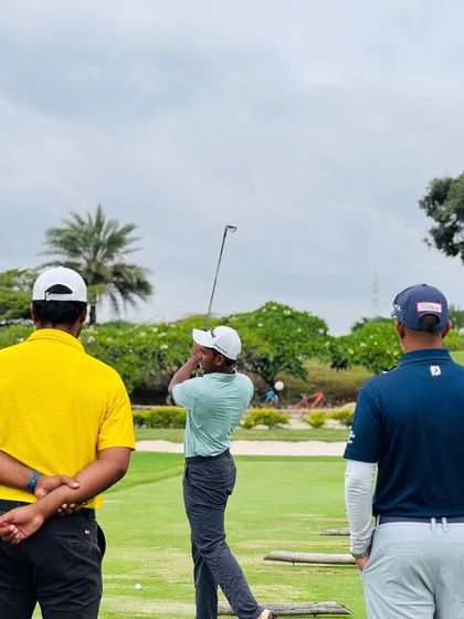 Coaches observing a player on the range. Nothing gives me more joy than being on the field, mentoring players and my team.