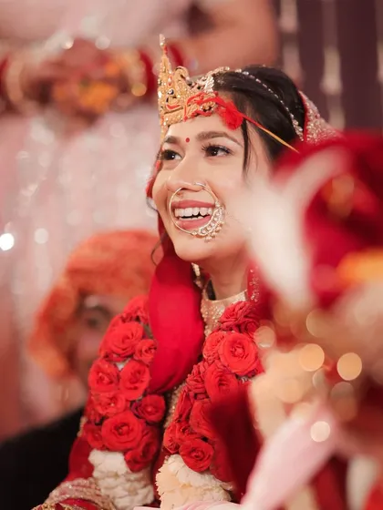 A radiant smile from the bride during the ceremony. We are always watching for these moments of pure joy amidst the formal rituals of the wedding day.