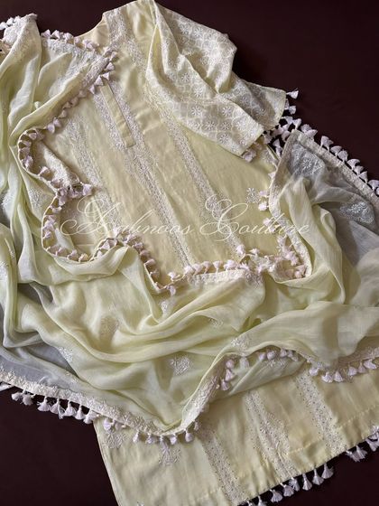 A full, straight-on flat lay of the lemon yellow ensemble.