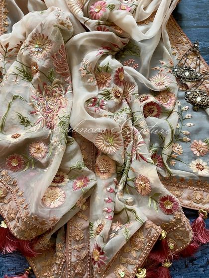 A full view of the draped dupatta, showing its generous size and intricate work.