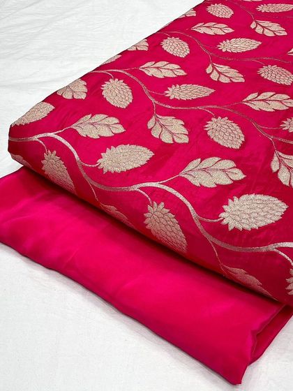Another view of the rani pink crepe jacquard fabric, showing the texture and sheen.