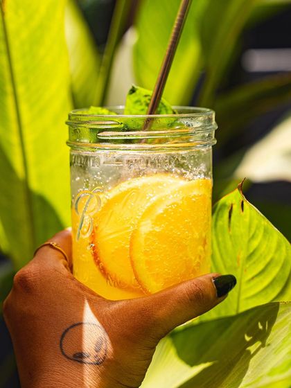 Our orange and mint soda, a bright and zesty drink perfect for a sunny day.
