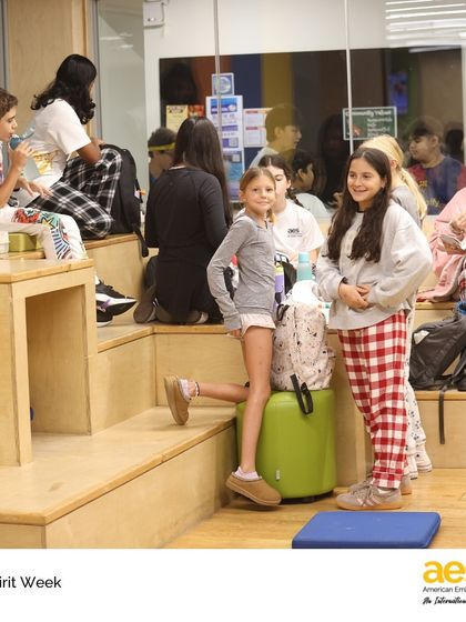 Students relax in the middle school common area during pajama day for Spirit Week. These themed days are a fun, low-pressure way to build camaraderie and show off individual style.