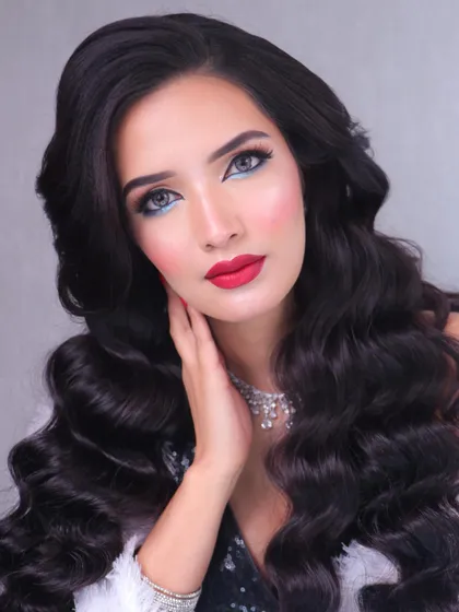 A super glam red carpet look featuring classic Hollywood waves and a bold red lip. This timeless look is all about elegance and sophistication.