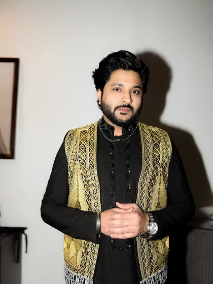 A portrait showcasing the intricate work on the golden jacket.