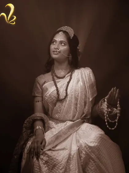 As Brahmacharini, the second form of Maa Parvati, this look represents discipline and learning. The simple white saree and rudraksha beads are styled to convey focus and self-discovery.
