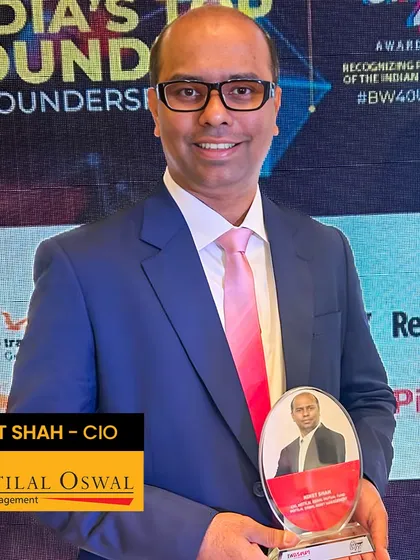 A client's success is our greatest pride. Here is Niket Shah, CIO at Motilal Oswal AMC, accepting his '40 Under 40' award. We crafted this magnetic blue merino wool suit to reflect his ambition, with details like broad lapels and a hand-finished Milanese buttonhole for a look of true power dressing.