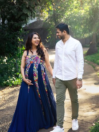 A candid moment of laughter and joy during a walk in the park. My goal is to make you feel so comfortable that we capture genuine smiles and connections.