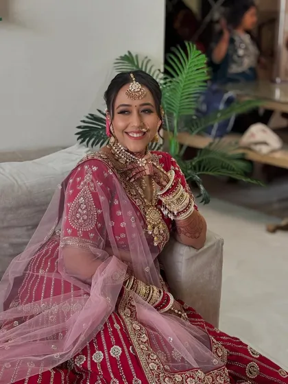 A joyful, smiling portrait of the bride. The makeup is designed to enhance her happiness and make her feel like the most beautiful version of herself.