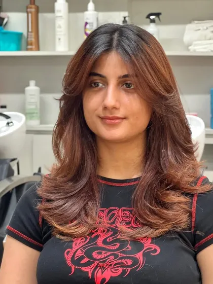 The final result of the layered haircut, looking soft, dimensional, and perfectly styled.