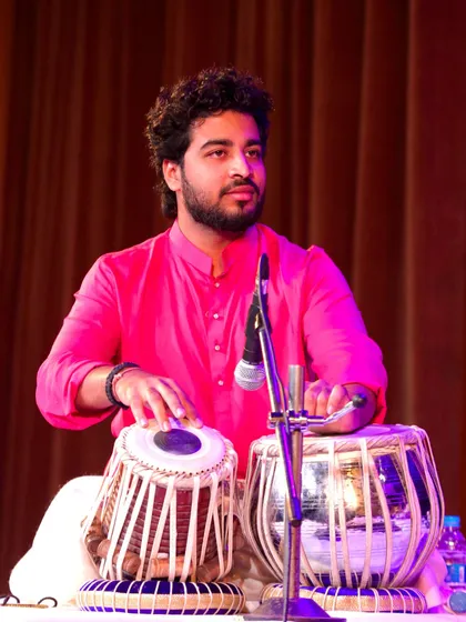 A candid shot from my performance at the Debadhara Festival, feeling the energy of the stage.