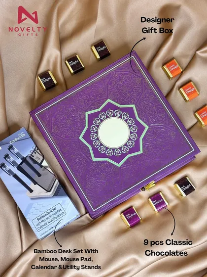 Perfect for an office colleague or client, this hamper combines work and pleasure. It features a bamboo desk set, nine pieces of classic chocolates, and a beautifully embossed designer gift box.