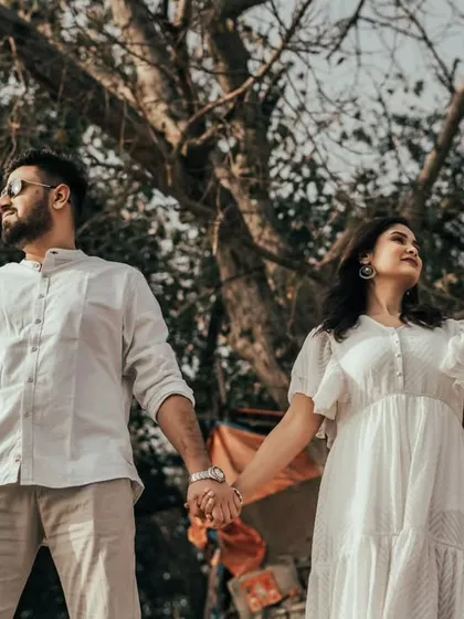Holding hands in a beautiful outdoor setting. Our open spaces and natural foliage provide a simple yet stunning backdrop for capturing genuine moments of connection.