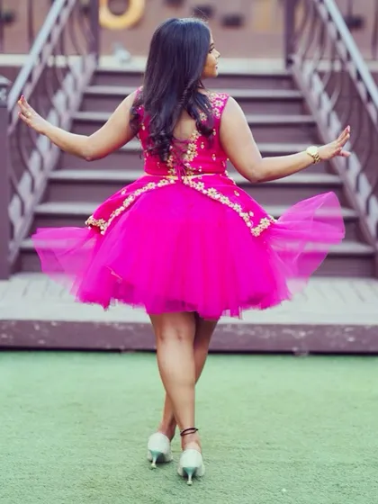 For a fun bachelorette party, I designed this vibrant pink tulle dress. The outfit features delicate embroidery and a playful silhouette, ensuring the bride-to-be is the center of attention.