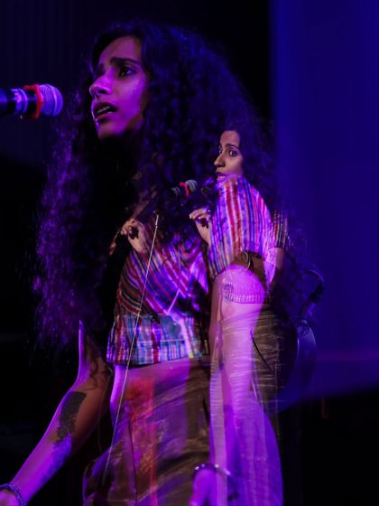 A creative double-exposure shot of singer Bawari Basanti performing on stage. This artistic photo captures the soulful and powerful presence of the artists we host.